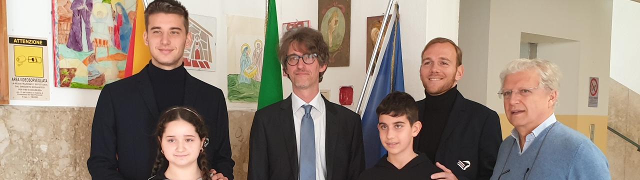 I giocatori del Palermo Calcio Martin Malaurye Manuel Peretti alla scuola media "Mazzini" dell'Istituto comprensivo Lombardo Radice di Palermo.